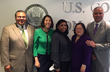 Photo of Sylvia Mendez with Commissioners and Staff Director